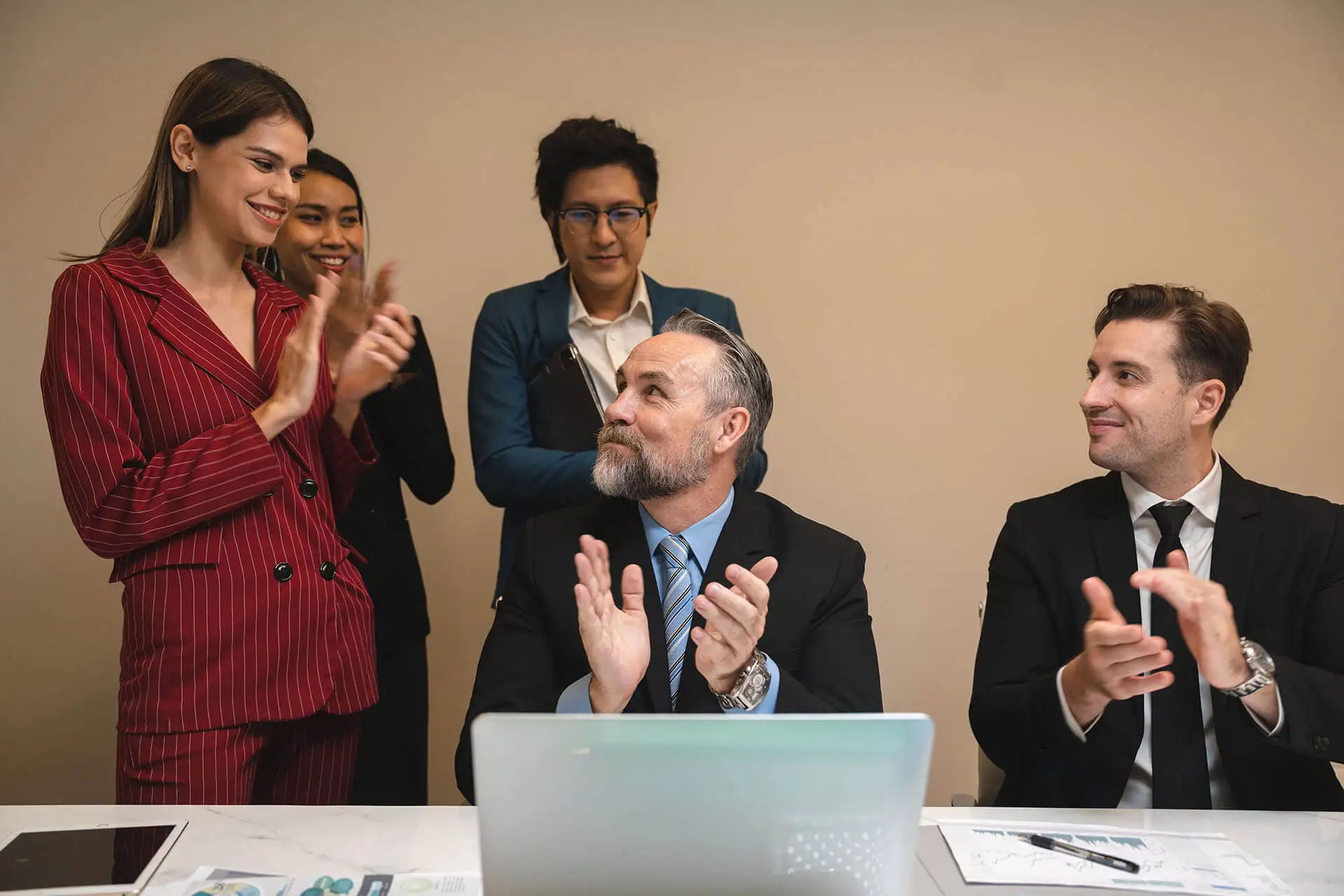 Business team clapping in a meeting.