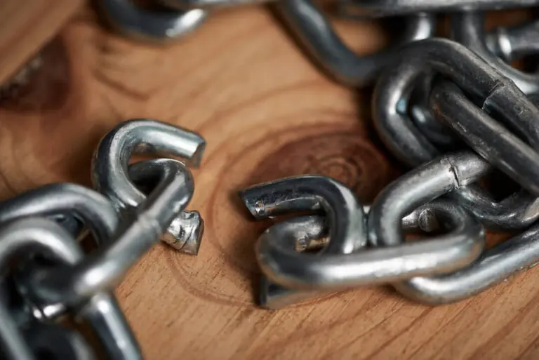 Close-up of a broken metal chain link.