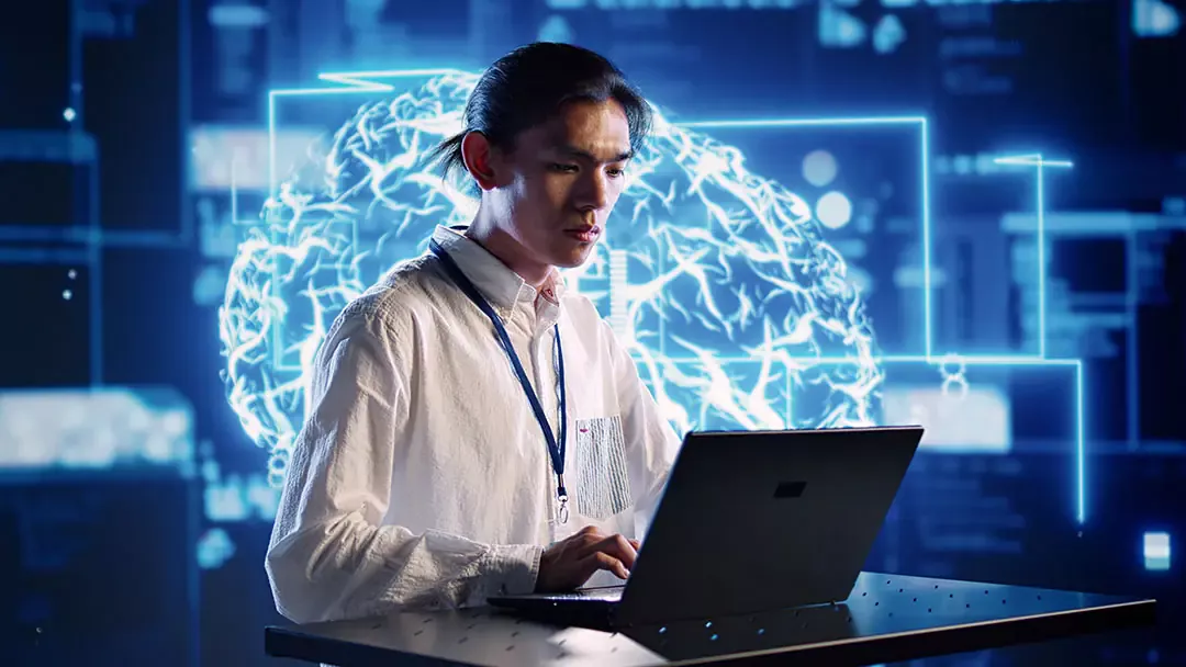 Person using laptop with digital brain background